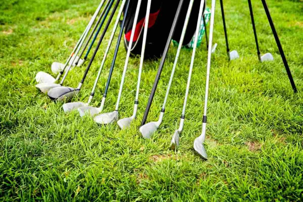 various golf clubs lined up to one another
