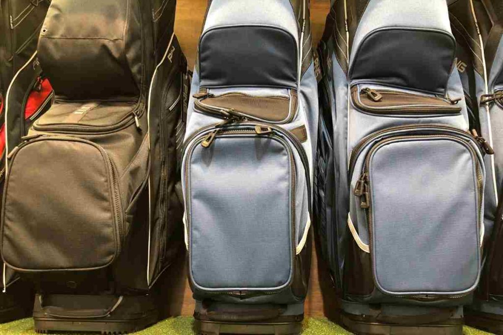 golf bags lined up with pockets showing