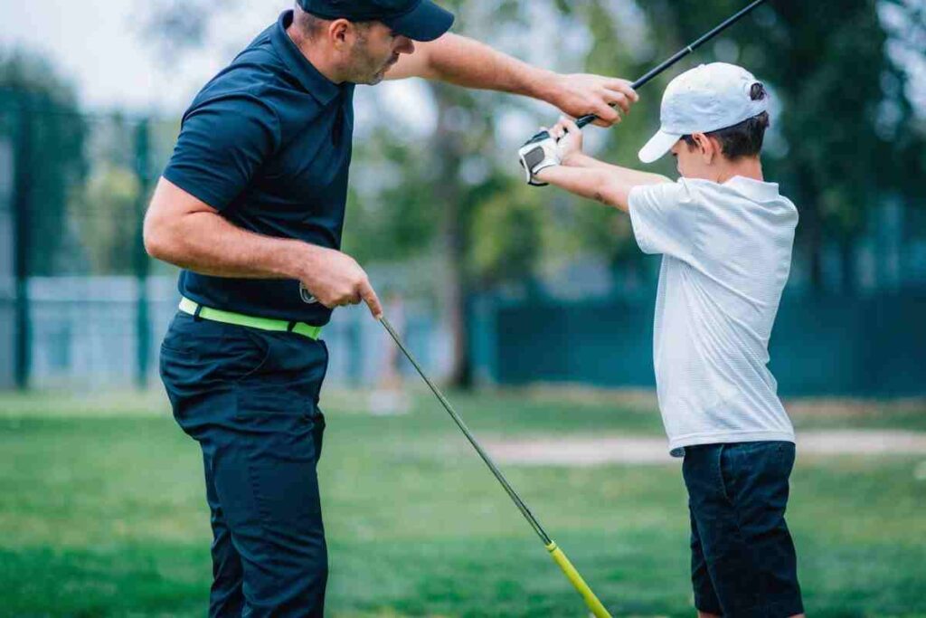 golfer training with an instructor