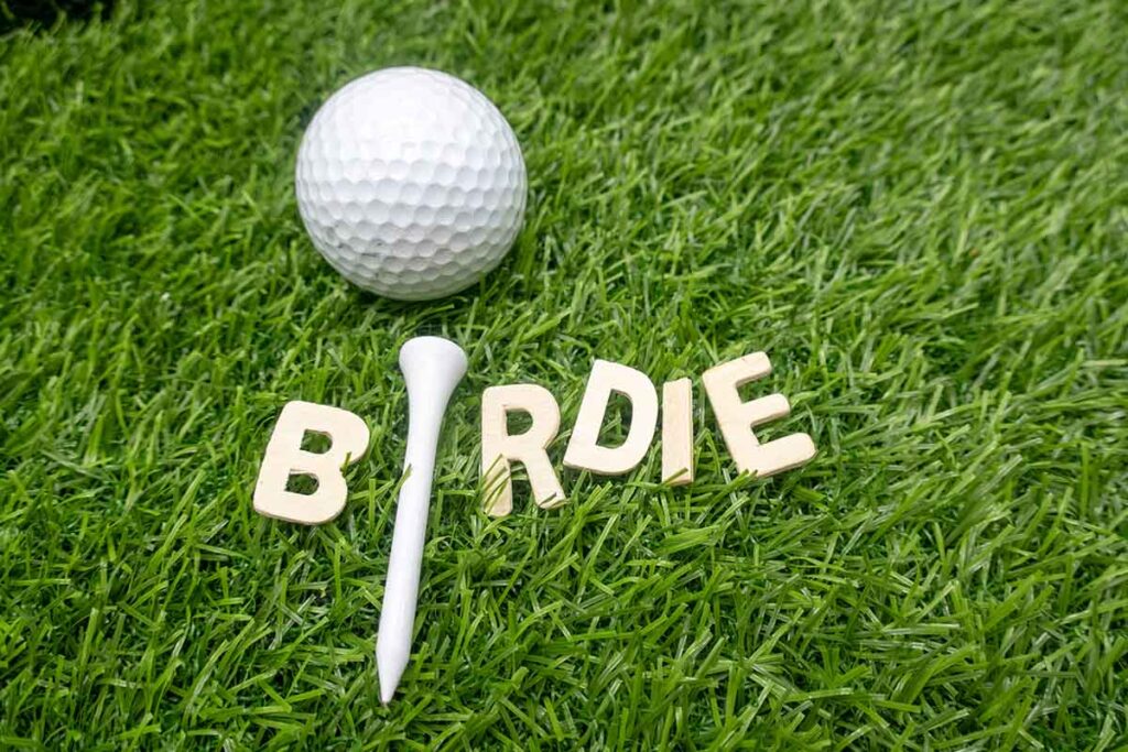 birdie sign next to golf ball