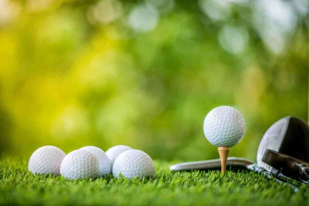 golf balls sitting in the grass