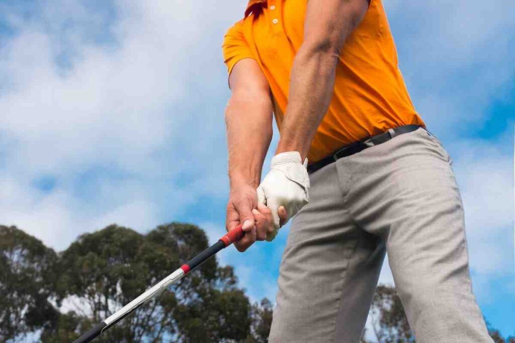 golfer gripping a golf club