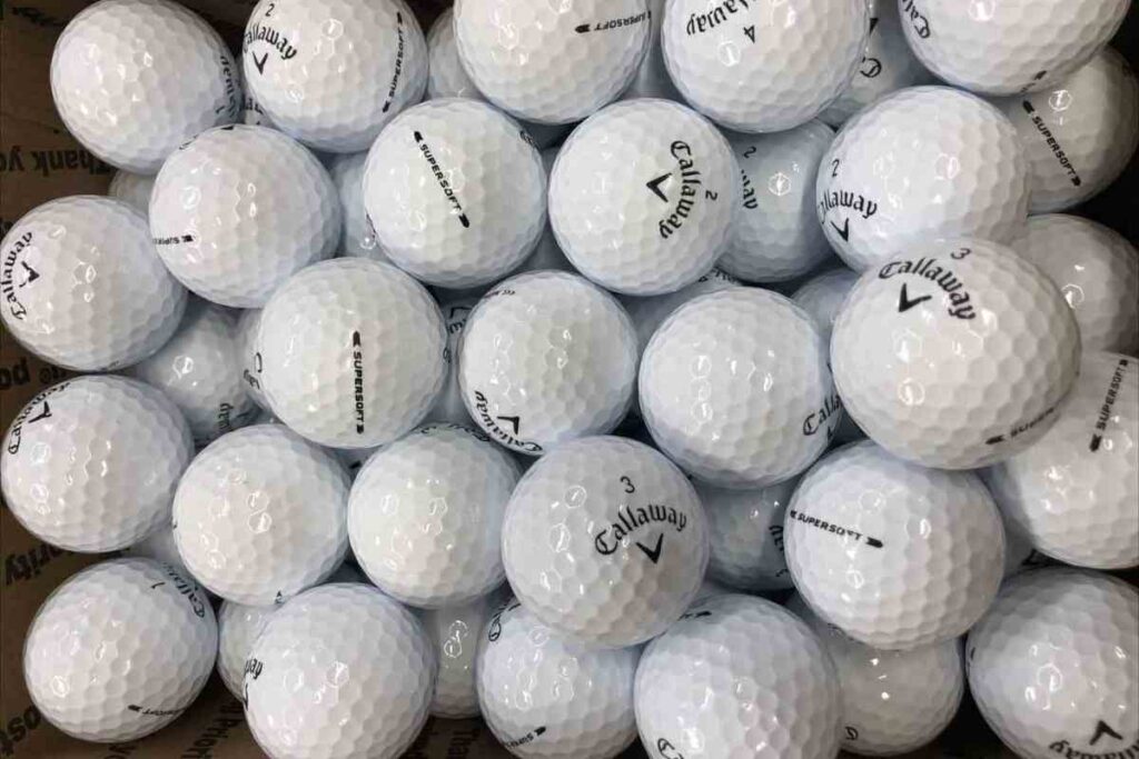 lots of callaway supersoft golf balls laid out