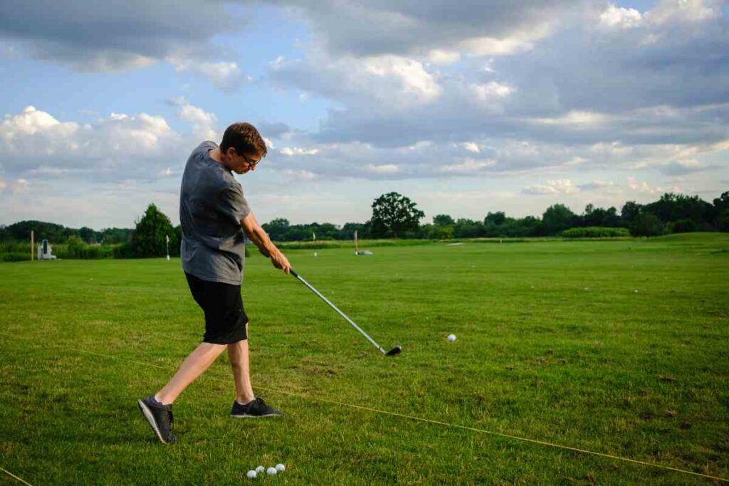 golfer making impact after completing downswing